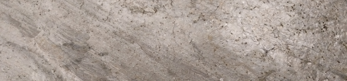 povrch kamene v šedých odstínech s diagonálním vrstvením v neobvyklém velkoformátu